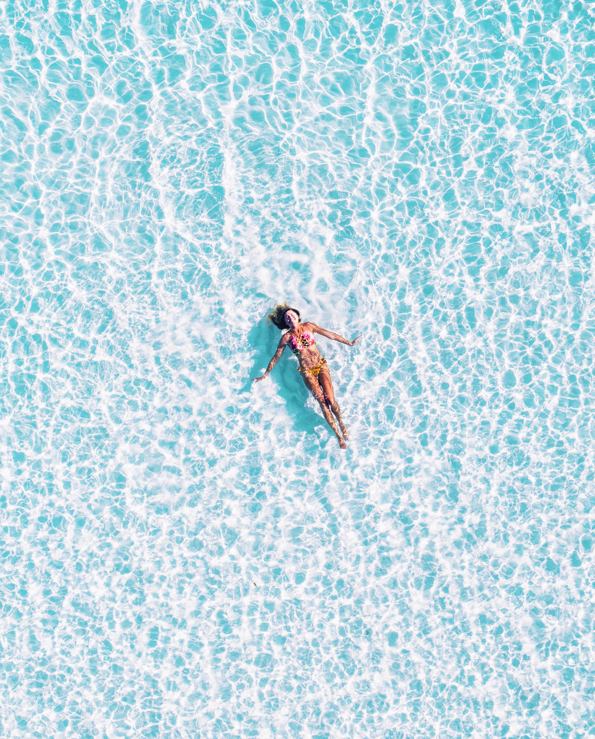 woman floating in a pool